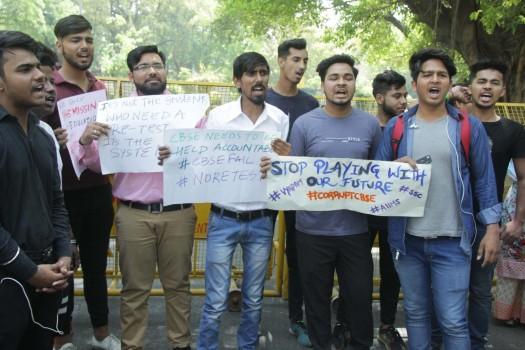 Students stage a demonstration against re-examination after the leak of CBSE Class X Maths and Class XII Economics papers, at Parliament Street in New Delhi on March 29, 2018.