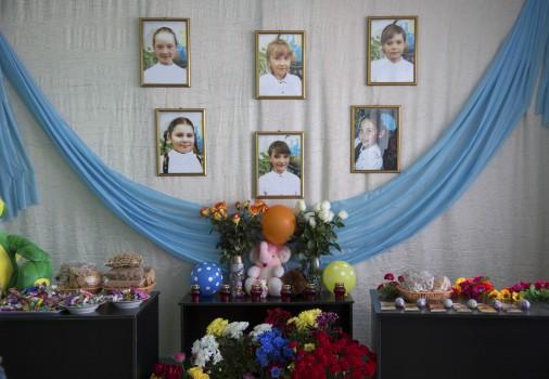 The portraits of the six schoolgirls, who were killed in a shopping mall fire, are on display in a hall of a local school in the settlement of Treshchevsky near Kemerovo, Russia March 29, 2018.