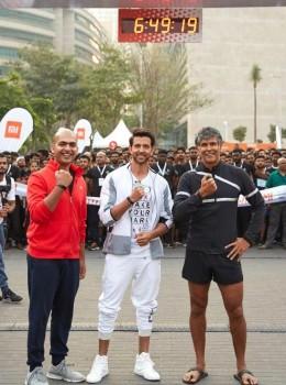 Bollywood actors Hrithik Roshan and Milind Soman with Xiaomi India Managing Director Manu Jain during a marathon in Bengaluru, on March 31, 2018.