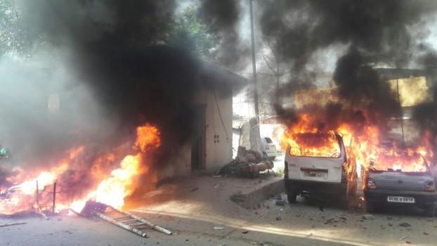 Vehicles set ablaze by protesters during a nation wide strike called to protest against the dilution of the SC/ST Prevention of Atrocities Act in Meerut, on April 2, 2018.