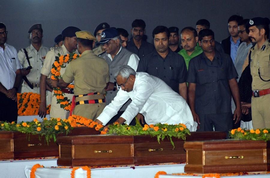 Bihar CM Nitish Kumar pays tribute to the Indian men killed by the Islamic State in Iraq's Mosul in 2014 after their mortal remains arrived in Patna on April 2, 2018. Bihar Chief Minister Nitish Kumar,Bihar CM Nitish Kumar,Nitish Kumar,Islamic State,Mortal