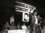 Winnie Mandela raises her fist in a black power salute after announcing that a massive pop concert will be held to mark the 70th birthday of her husband, jailed black nationalist leader Nelson Mandela on July 17, 1988.