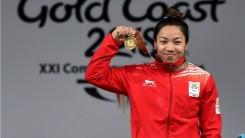 Mirabai Chanu won the first gold for India at the 21st edition of the Commonwealth Games with a power packed performance in the women's 48 kilogram category here on Thursday. The Manipuri powerhouse left the competition far behind by setting Games records in the snatch, clean and jerk as well as the total.