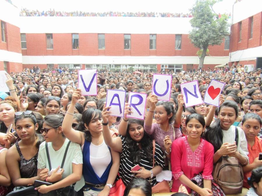 Students cheer during actor Varun Dhawan's visit to Lakshmibai College for the promotions of his upcoming film "October" in New Delhi on April 5, 2018. Varun Dhawan,actor Varun Dhawan,Varun Dhawan promotes October,October,October movie,October movie promotion,October movie promotion pics,October movie promotion images