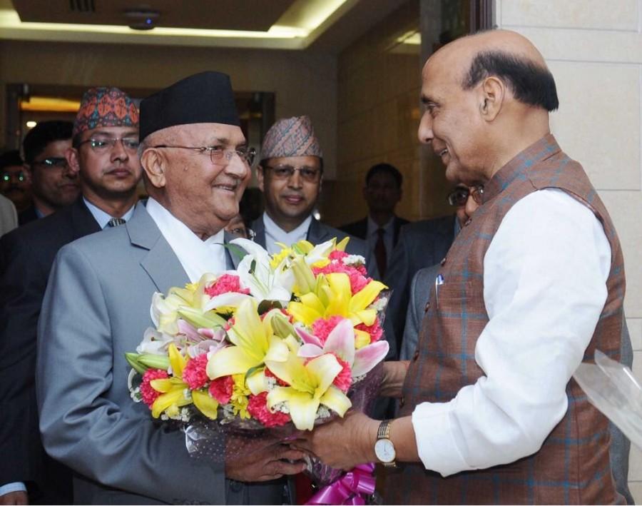 Nepal Prime Minister K.P. Oli arrived here on Friday on a three-day visit -- his first foreign trip after he returned to power in February for a second time. Oli and his wife Radika Shakya were received by Union Home Minister Rajnath Singh at the airport here. Oli's first foreign visit to India after taking charge as Nepal Prime Minister keeps up with the tradition of India-Nepal ties that have of late been strained. He is scheduled to have talks with Prime Minister Narendra Modi and also hold delegation-level talks on Saturday. Nepal PM KP Sharma Oli,KP Sharma Oli,KP Sharma Oli in India,Nepal PM in Delhi,Radika Shakya,Union Home Minister Rajnath Singh,Rajnath Singh