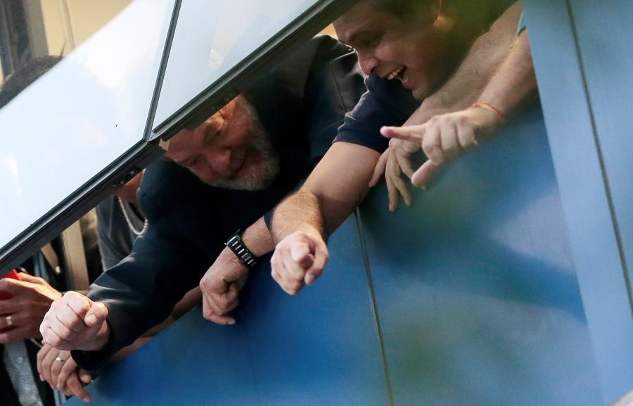 Former Brazilian President Luiz Inacio Lula da Silva waves to supporters from a window during a protest at the metallurgic trade union in Sao Bernardo do Campo, Brazil April 6, 2018. Brazil,President Luiz Inacio Lula da Silva,Lula defies prison order