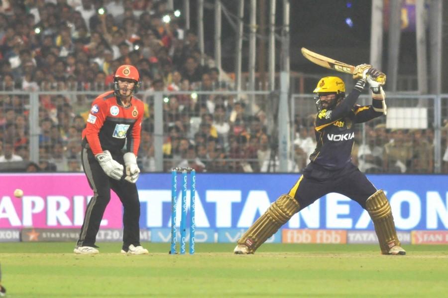 Kolkata Knight Riders (KKR) rode on Nitish Rana's all-round show and Sunil Narine's whirlwind 19-ball 50 to beat Royal Challengers Bangalore (RCB) by four wickets in an Indian Premier League (IPL) clash here on Sunday. In front of a packed Eden Gardens and co-owner Shah Rukh Khan, part time off-spinner Rana (2/11) picked up the big wickets of A.B. de Villiers and skipper Virat Kohli in successive deliveries to reduce the visitors to 127/4 in 14.3 overs. Kolkata Knight Riders,Kolkata Knight Riders beat Royal Challengers Bangalore,KKR beat RCB,RCB,Royal Challengers Bangalore,Virat Kohli,IPL 2018,IPL 2018 pics,IPL 2018 images