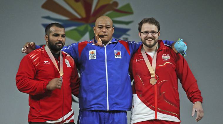Indian weightlifter Pardeep Singh took silver in the men's 105 kilogram category at the 21st Commonwealth Games (CWG) here on Monday. Pardeep lifted 152 kg in snatch and 200 kg in clean and jerk to register a total of 352 kg. Sanele Mao of Samoa won gold with a total of 360 kg. He lifted 154 kg in snatch and 206 kg in clean and jerk. Weightlifter Pardeep Singh,Pardeep Singh,Pardeep Singh wins Silver,Commonwealth Games 2018,CWG 2018,Pardeep Singh pics,Pardeep Singh images