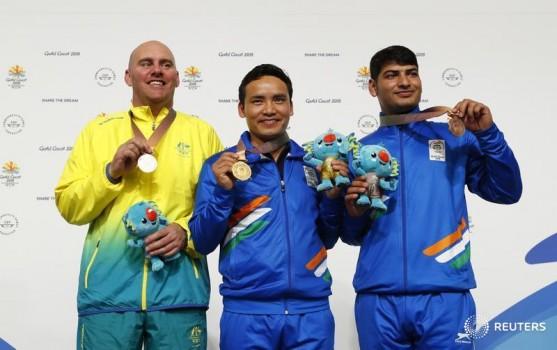 India's star shooter Jitu Rai won gold with a masterful performance in the men's 10m Air Pistol event at the 21st Commonwealth Games here on Monday. Jitu created a new CWG record of 235.1 in the final to win the gold. Kerry Bell of Australia took silver with 233.5.