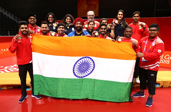 India clinched a historic gold in men's table tennis, thrashing Nigeria 3-0 in the final of the event at the 21st Commonwealth Games here on Monday. After beating Singapore in the semi-finals earlier on Monday, the Indian team continued their dominance in the final, by winning all the first three matches to comfortably clinch the gold. Seasoned paddler Achanta Sharath Kamal gave India an early 1-0 lead with a thumping 4-11, 11-5, 11-4, 11-9 comeback win over Bode Abiodun in the first singles match of the contest. CWG 2018,Commonwealth Games,Commonwealth Games 2018,table tennis team,Achanta Sharath Kamal,Bode Abiodun