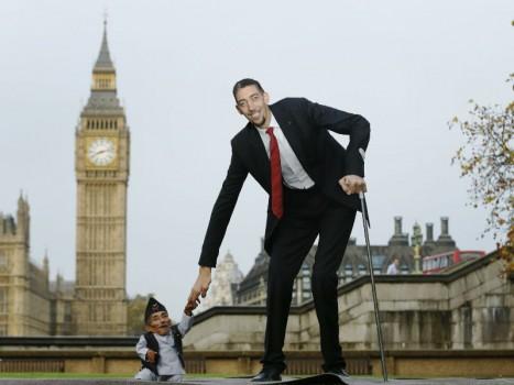 The world's shortest man Chandra Bahadur Dangi greets the tallest living man Sultan Kosen to mark the Guinness World Records Day in London November 13, 2014. Kosen measuring 251cm, towers over Dangi who is only 54.6cm tall. The Guinness World Records celebrates its 60th edition of the annual records book.