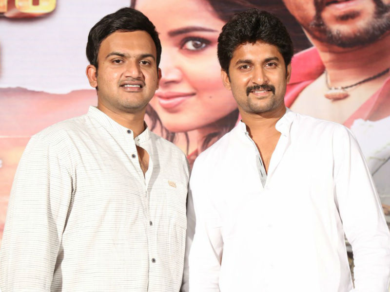 Merlapaka Gandhi and Nani pose together during Krishnarjuna Yudham movie press meet. Krishnarjuna Yudham press meet,Krishnarjuna Yudham,Nani,Merlapaka Gandhi,Nani at Krishnarjuna Yudham press meet,Krishnarjuna Yudham press meet pics,Krishnarjuna Yudham press meet images,Dil Raju