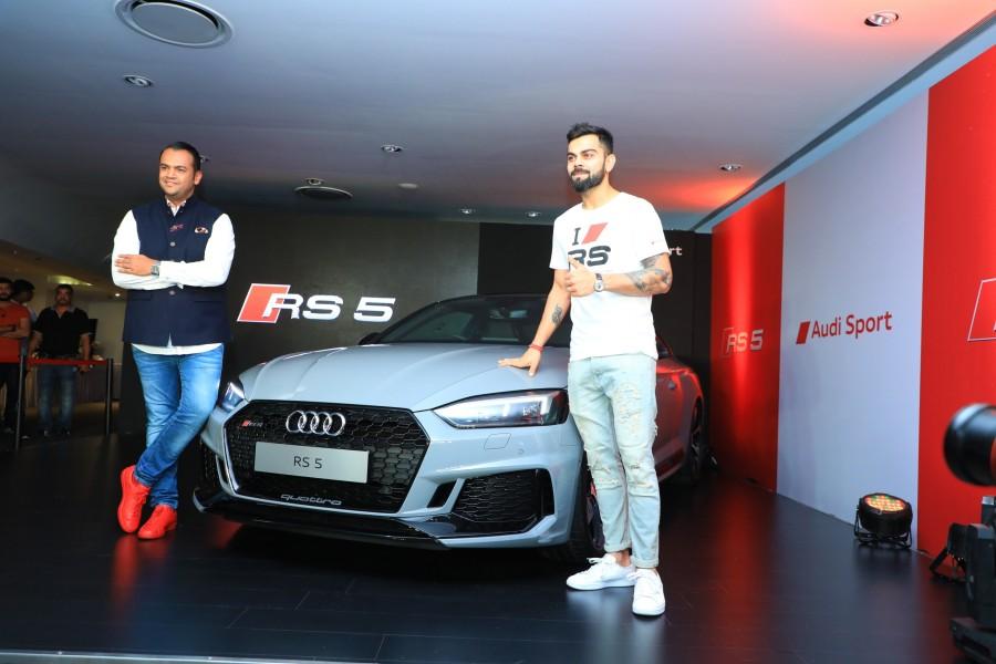Mr. Rahil Ansari, Head, Audi India with Indian Cricket Team Captain Virat Kohli unveiling the Audi RS 5 Coupe in Bengaluru. Priced at INR 1,10,65,000, the all new Audi RS 5 Coupé is now available at all Audi dealerships across India. Virat Kohli,Audi RS 5 Coupé,Audi RS 5 Coupé in India,Audi RS 5 Coupé pics,Audi RS 5 Coupé images,German luxury car
