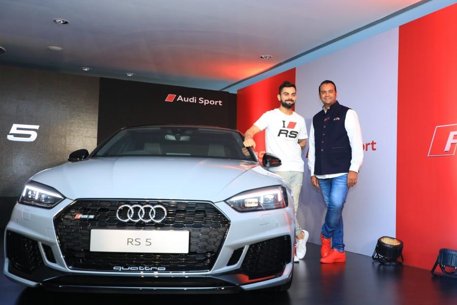 Mr. Rahil Ansari, Head, Audi India with RCB Cricket Team Captain Virat Kohli unveiling the Audi RS 5 Coupe in Bengaluru. Audi Sport is presenting its first model to feature the new RS design philosophy in India. Virat Kohli,Audi RS 5 Coupé,Audi RS 5 Coupé in India,Audi RS 5 Coupé pics,Audi RS 5 Coupé images,German luxury car