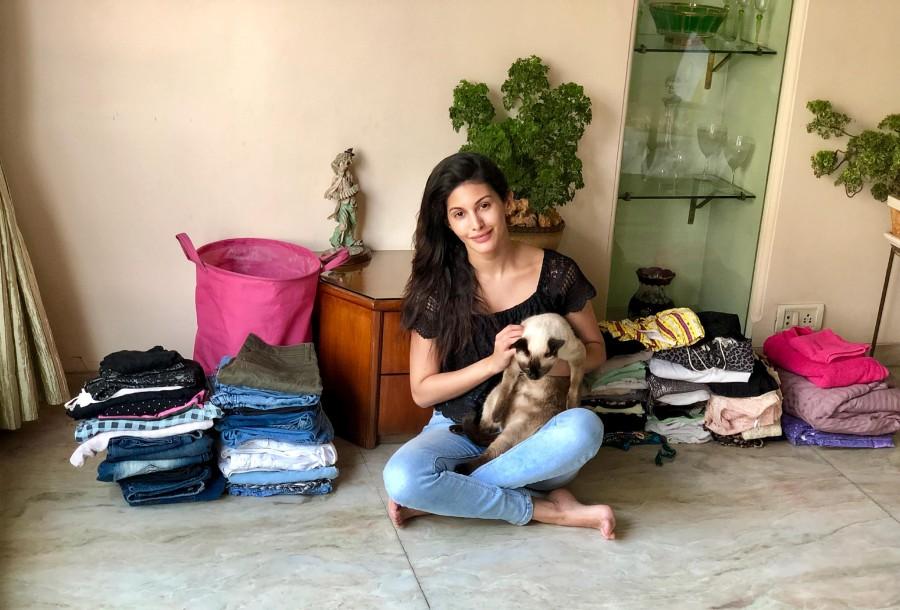 Model turned actress Amyra Dastur’s love for animals knows no bounds. In a sheer act of love, Amyra has decided to donate her own clothes (some of which are brand new and haven’t been worn), worth a lake of rupees, towards a garage sale organised by the animal charity she is associated with, 'World for All.' Amyra Dastur,actress Amyra Dastur,Amyra Dastur with dogs,Amyra Dastur with cats,Amyra Dastur with pet animals,Amyra Dastur adorable pets,Amyra Dastur pics,Amyra Dastur images