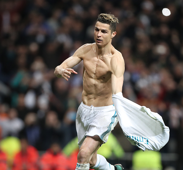 Cristiano Ronaldo of Real Madrid CF celebrates scoring his side's first goal at the end of the UEFA Champions League Quarter Final second leg match between Real Madrid and Juventus at Estadio Santiago Bernabeu on April 11, 2018 in Madrid, Spain. Cristiano Ronaldo goes shirtless,Cristiano Ronaldo shirtless,Cristiano Ronaldo,Real Madrid,Champions League,Champions League semi-final,Cristiano Ronaldo 150th match,Champions League pics,Champions League images