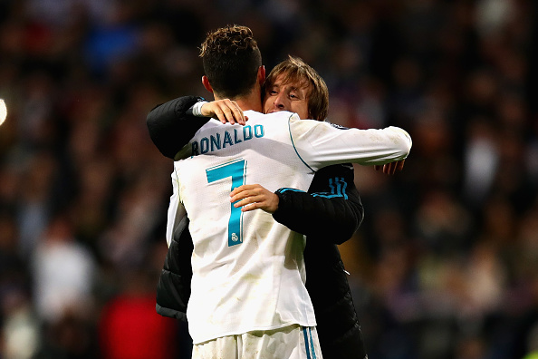 Cristiano Ronaldo of Real Madrid is hugged by teammate Luka Modric after the UEFA Champions League Quarter Final, second leg match between Real Madrid and Juventus at Estadio Santiago Bernabeu on April 11, 2018 in Madrid, Spain. Cristiano Ronaldo goes shirtless,Cristiano Ronaldo shirtless,Cristiano Ronaldo,Real Madrid,Champions League,Champions League semi-final,Cristiano Ronaldo 150th match,Champions League pics,Champions League images