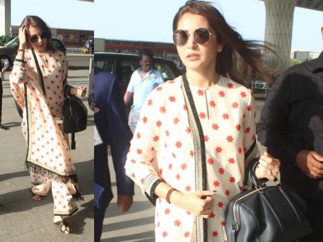Yet again Bollywood actress Anushka Sharma gives us the perfect airport look with Sabyasachi kurta-palazzo with black sunglasses.