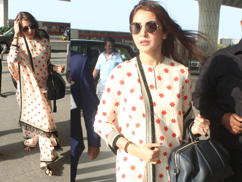 Yet again Bollywood actress Anushka Sharma gives us the perfect airport look with Sabyasachi kurta-palazzo with black sunglasses. Anushka Sharma,actress Anushka Sharma,Anushka Sharma at Airport,Anushka Sharma at Mumbai Airport,Anushka Sharma in Sabyasachi kurta-palazzo,Virat Kohli,Virat Kohli wife