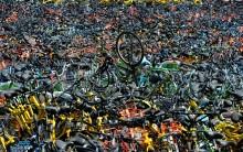 Bicycles of various bike-sharing services are seen at a vacant lot in Wuhan, Hubei province, China.