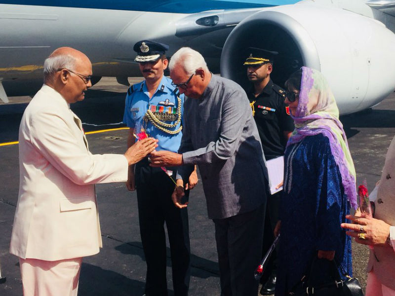 President Ram Nath Kovind arrived here on Wednesday on a two-day visit to Jammu and Kashmir amid heightened security. He was received by Governor NN Vohra and Chief Minister Mehbooba Mufti. He headed straight for the Raj Bhawan from where he is scheduled to leave for the Shri Mata Vaishno Devi University (SMVDU) in Katra town for a convocation. Over 880 scholars will receive their degrees and merit certificates at the ceremony. President Ram Nath Kovind,Ram Nath Kovind,Ram Nath Kovind in Jammu and Kashmir,Ram Nath Kovind visits Jammu and Kashmir,Ram Nath Kovind pics,Ram Nath Kovind images