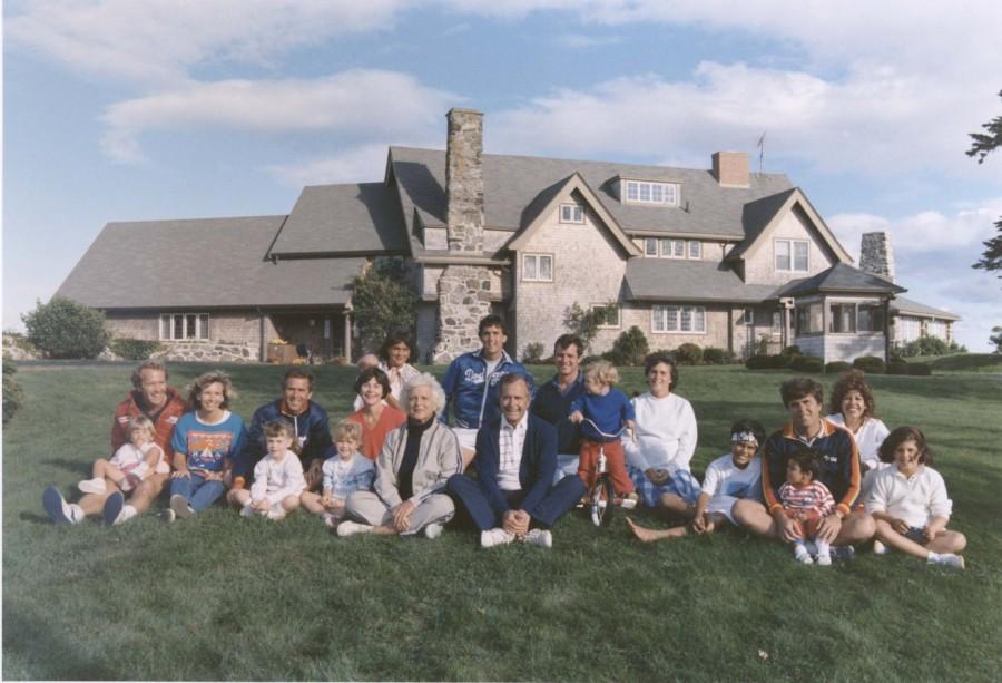 Portrait of the Bush family sitting in front of their home in Kennebunkport, Maine. BACK ROW: Maragret Bush (Marvin's wife), holding daughter Marshall, Marvin Bush, Bill LeBlond (Doro's Husband). FRONT ROW: Neil Bush holding son Pierce, Sharon (Neil's wife), George W. Bush holding daughter Barbara Bush, George Bush, Sam LeBlond (Doro's son), Doro Bush LeBlond, George P. Barbara Bush passes away,Barbara Bush,Barbara Bush dead,Barbara Bush passes,former First Lady,Barbara Bush rare pics,Barbara Bush rare images,Barbara Bush rare unseen pics,Barbara Bush rare unseen images