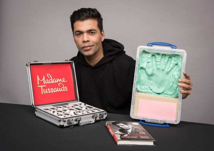 Filmmaker Karan Johar says he feels honoured to be the first filmmaker from India to have a wax statue at the Madame Tussauds. Karan on Thursday tweeted a photograph of himself, holding a briefcase in one hand and a wax imprint of his palm on the other hand. A copy of his biography "An Unsuitable Boy" is also seen kept in front of him. "Honoured to be the first filmmaker from India at the prestigious Madame Tussauds. Thank you to the entire team in London who worked tirelessly... Will have further details about when and where soon! Madame Tussauds," he captioned the image. Karan Johar,Karan Johar wax statue,Karan Johar statue,Karan Johar wax statue at Madame Tussauds,Madame Tussauds,celebs at Madame Tussauds,Madame Tussauds pics,Madame Tussauds images