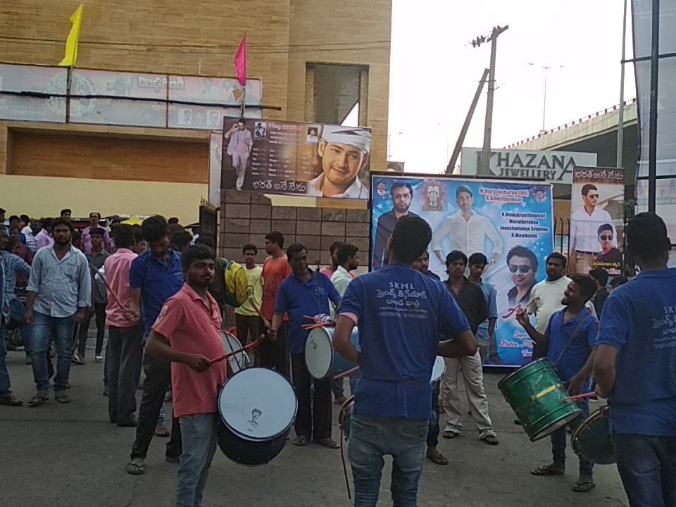 Fans dance to live music in front of large posters and cutouts of the movie 'Bharat Ane Nenu' and its star Mahesh Babu. Mahesh Babu,actor Mahesh Babu,Bharat Ane Nenu,Bharat Ane Nenu release,Bharat Ane Nenu box office collection,Mahesh Babu fans,Bharat Ane Nenu mania,Bharat Ane Nenu celebration