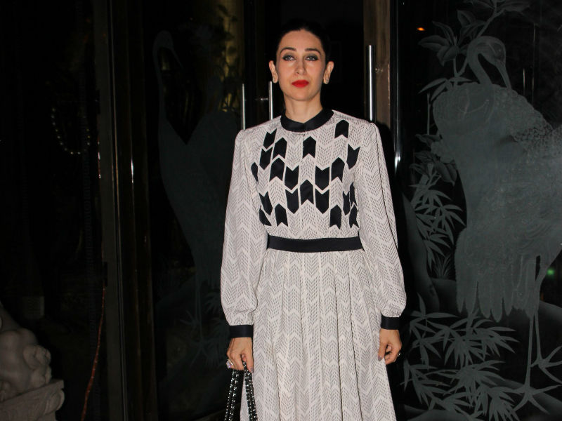 Karisma Kapoor poses for the cameras during Babita Kapoor's birthday party in Mumbai. Kareena Kapoor Khan,babita kapoor 70th birthday photos,karisma kapoor,kareena kapoor khan saif ali khan,Babita Kapoor,Babita Kapoor's birthday,celebs at Babita Kapoor,Babita Kapoor birthday pics,Babita Kapoor birthday images