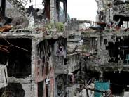 A woman stands at her ruined house, after residents were allowed to return to their homes for the first time since the battle between government troops and Islamic State militants began on May 2017, at the Islamic city of Marawi, Philippines April 19, 2018.
