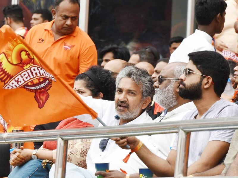 Filmmaker S. S. Rajamouli, his wife Rama Rajamouli and music director M. M. Keeravani during an IPL 2018 match between Chennai Super Kings and Sunrisers Hyderabad at Rajiv Gandhi International Cricket Stadium in Hyderabad on 22 April, 2018. However, Chennai Super Kings (CSK) pipped Sunrisers Hyderabad by four runs on Sunday to return to the top of the Indian Premier League (IPL) table. SRHvs CSK,Sunrisers Hyderabad,SS Rajamouli and Keeravani,SS Rajamouli,Keeravani,SS Rajamouli at IPL,SS Rajamouli during IPL,Baahubali director