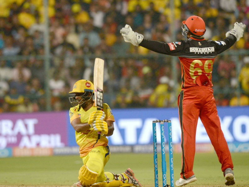 De Villiers miscued Tahir's tossed-up delivery pitched outside off-stump for Sam Billings to complete the formalities at deep cover. Tahir immediately got rid of New Zealand's Anderson with a googly as Harbhajan Singh completed a brilliant catch at slip. With the hosts comfortably placed at 142/4, Mandeep Singh (32 off 17; 4x1, 6x3) and Colin de Grandhomme (11) struck a few lusty blows towards the end, even as two run-outs and a wicket in the final over could not stop RCB from crossing the 200-run mark. During the chase, Chennai were off to a shaky start, losing opener Shane Watson (7), who was trying to clear the mid-on boundary, in the very first over. Incoming batter Suresh Raina then shared a 42-run partnership with Rayudu, helping CSK touch the 50-run mark. Chennai Super Kings,Royal Challengers Bangalore,Chennai Super Kings vs Royal Challengers Bangalore,CSK beats RCB,IPL 2018,IPL,Indian Premier League,Indian Premier League 2018,Indian Premier League pics,Indian Premier League images