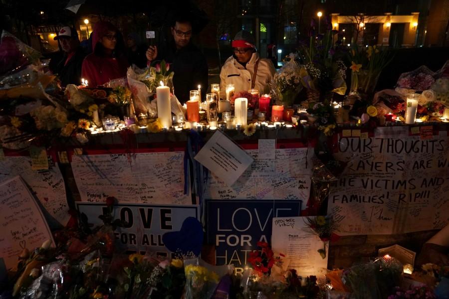 The man accused of driving a van to attack pedestrians in Toronto was charged on Tuesday with 10 counts of first-degree murder and 13 counts of attempted murder. The 25-year-old suspect, Alek Minassian, plowing a rented van into pedestrians on a crowded Toronto sidewalk on Monday, killed 10 people, injuring 15 others in Canada's deadliest mass killings in decades. Mourners attend a candlelight vigil at the makeshift memorial a day after a van struck multiple people along a major intersection in north Toronto, Ontario, Canada, April 24, 2018. Toronto van attack,Toronto van attack mourn,mass killing,Toronto sidewalk