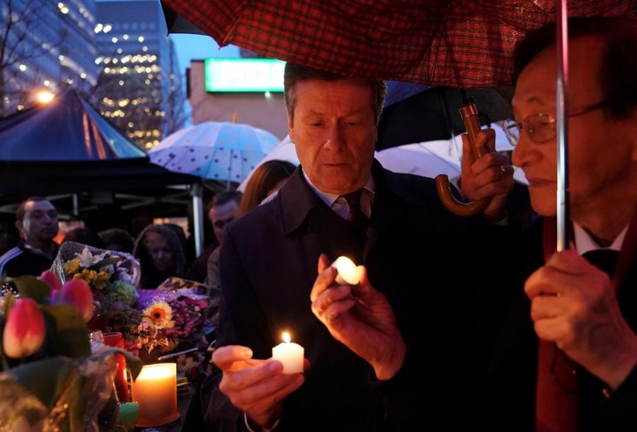 Toronto Mayor, John Tory, attends a candlelit vigil at the makeshift memorial a day after a van struck multiple people along a major intersection in north Toronto, Ontario, Canada, April 24, 2018. Toronto van attack,Toronto van attack mourn,mass killing,Toronto sidewalk