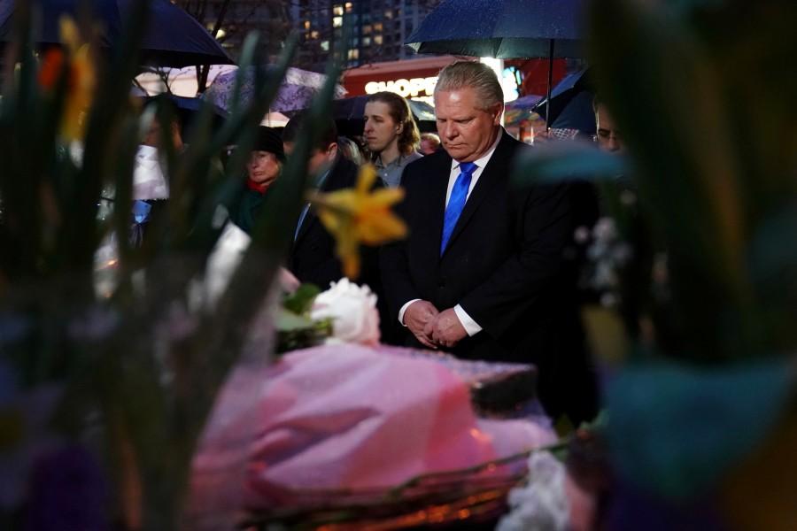 Ontario PC Party leader Doug Ford attends a candle light vigil at the makeshift memorial a day after a van struck multiple people along a major intersection in north Toronto, Ontario, Canada, April 24, 2018. Toronto van attack,Toronto van attack mourn,mass killing,Toronto sidewalk