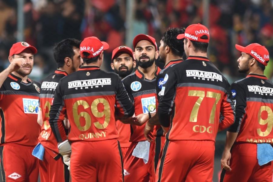 Royal Challengers Bangalore (RCB) pulled off an excellent bowling performance to defeat Mumbai Indians by 14 runs in an Indian Premier League (IPL) clash at the M. Chinnaswamy Stadium here on Tuesday. Chasing a managable target of 168 runs, Mumbai lost wickets at regular intervals and could only post 153/7 in their 20 overs. Except for Hardik Pandya, who scored a patient 50 off 42 deliveries, the rest of the Mumbai batsmen were unable to stand up to the RCB bowlers. RCB are now at the fifth spot in the IPL table with six points from their eight matches. Mumbai are second from bottom in the eight-team ladder with four points from eight matches. Royal Challengers Bangalore beat Mumbai Indians,RCB beat MI,Virat Kohli,Indian Premier League,Indian Premier League 2018,Indian Premier League pics,Indian Premier League images,IPL pics,IPL images,IPL stills