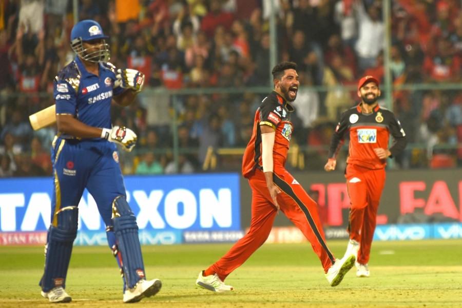 Brief scores: Royal Challengers Bangalore: 167/7 (Manan Vohra 45, Brendon McCullum 37; Hardik Pandya 3/28) vs Mumbai Indians: 153/7 in 20 overs (Hardik Pandya 50, Krunal Pandya 23, Jean-Paul Duminy 23). Royal Challengers Bangalore beat Mumbai Indians,RCB beat MI,Virat Kohli,Indian Premier League,Indian Premier League 2018,Indian Premier League pics,Indian Premier League images,IPL pics,IPL images,IPL stills