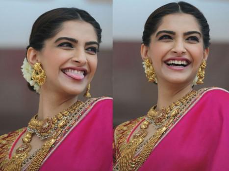 We just saw a sneak peek of Sonam as a fun bride during her wedding. You can imagine how busy her million dollar smile will keep the cameras at the wedding.