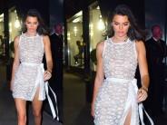 Model-reality TV star Kendall Jenner flashed almost everything as she wore a completely see-through outfit for an outing here. The model, 22, confidently strutted into a Tiffany & Co party on Thursday night in a sheer white and silver dress that also featured a daring thigh split. As well as showing off plenty of her long and lean legs, Kendall's bare cleavage was also clearly visible under the see-through fabric.