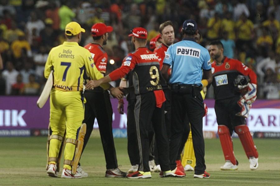 Chennai Super Kings (CSK) made a heavy weather of a small total before captain Mahendra Singh Dhoni did his famous finishing act to beat Royal Challengers Bangalore (RCB) by six wickets and virtually seal their place in the Indian Premier League (IPL) play-offs here on Saturday, needing just one more win in five matches. RCB, on the other hand, are virtually out of the race for the play-offs. They are currently on six points and have to win all their five remaining matches, which is a big ask for the off-colour unit. The Chennai are sitting pretty on top of the table with 14 points from 10 matches. They have won seven of those matches while losing three. The Chennai team, which has a reputed batting line-up, were expected to acomplish the job quite easily. But the team put themselves under pressure in the slog overs before skipper Dhoni smashed three sixes off RCB's star spinner Yuzvendra Chahal to take his side across the line in the 18th over. Chennai Super Kings beat Royal Challengers Bangalore,CSK beats RCB,Chennai Super Kings,Royal Challengers Bangalore,Virat Kohli,MS Dhoni,Indian Premier League,Indian Premier League 2018,IPL,IPL 2018