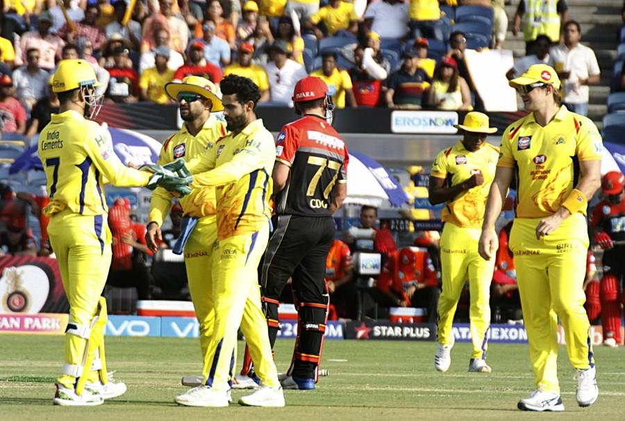 But his move did not pay off as Ravindra Jadeja struck a big blow with his first ball of the match when he bowled the RCB skipper with a delivery that turned in sharply after pitching. CSK struck another big blow in the very next over when the dangerous AB De Villiers was stumped off Harbhajan Singh's bowling. Jadeja got his second wicket when Mandeep Singh miscued a slog sweep, only to find David Willey at deep backward square leg. Patel however, continued to battle on at the other end bringing up his half-century with a single off Harbhajan in the 12th over. However, he too fell victim to the resurgent Jadeja when a mistimed flick handed an easy return catch to the CSK all-rounder. Chennai Super Kings beat Royal Challengers Bangalore,CSK beats RCB,Chennai Super Kings,Royal Challengers Bangalore,Virat Kohli,MS Dhoni,Indian Premier League,Indian Premier League 2018,IPL,IPL 2018