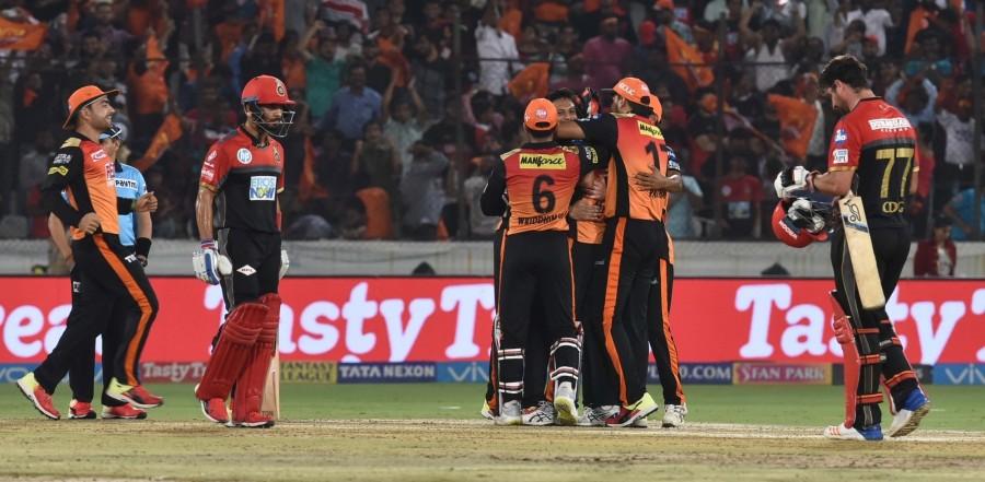 Sunrisers Hyderabad consolidated their stay atop the Indian Premier League (IPL) points table with yet another brilliant defence of a meagre total, that saw them pip struggling Royal Challengers Bangalore (RCB) by five runs here at the Rajiv Gandhi International Stadium on Monday. This was the Orange Army's eighth win from 10 matches and look on course for the play-offs with already 16 points in their kitty. On the other hand, Virat Kohli's sixth-placed RCB virtually find themselves out of the race to the play-offs after succumbing to their seventh loss in 10 outings and are likely to play the party spoilers from here on. Sunrisers Hyderabad beat Royal Challengers Bangalore,SRH beats RCB,Virat Kohli,Indian Premier League,Indian Premier League 2018,IPL 2018,IPL 2018 pics,IPL 2018 images