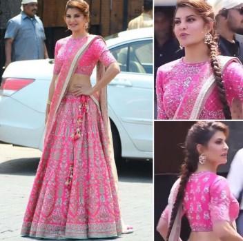 Bollywood film actress Jacqueline Fernandez stunned everyone yet again wearing a pink color lehenga at her Best friend Sonam Kapoor's wedding today. Jacqueline Fernandez looked like a princess as she adorned hot pink lehenga set. The pink Anita Dongre lehenga had elaborate motifs on it and paired it with a complimenting dupatta. The actress accessorized her look with a pair of gold and pearl chandbali-inspired earrings and a Kundan handcuff.