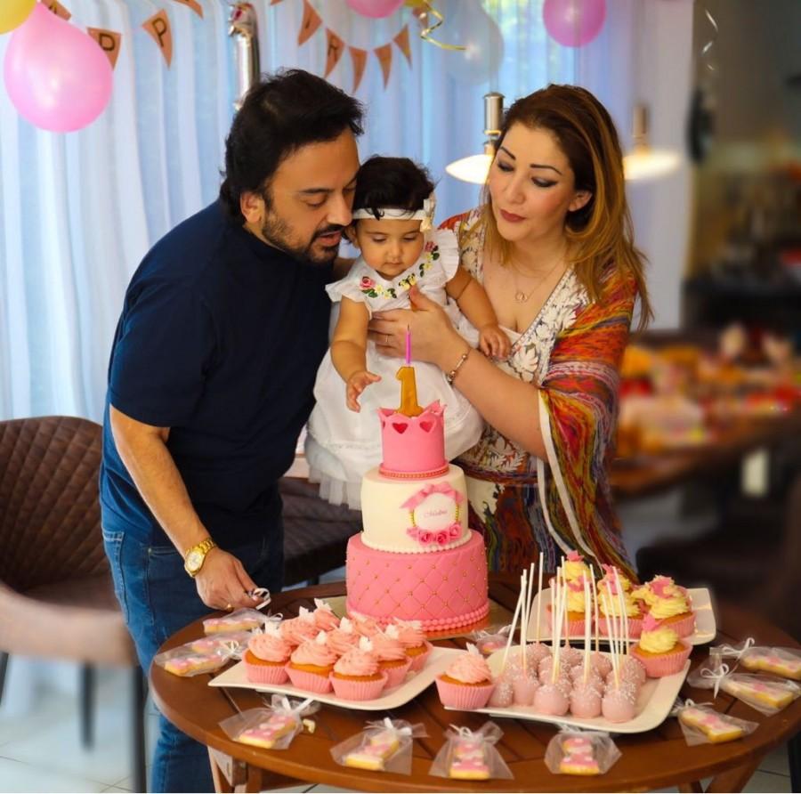 Singer Adnan Sami celebrated his "Angelic" daughter Medina's first birthday in Germany. Adnan and his wife Roya Sami welcomed their first child, Medina, on May 8 last year. "I know that God truly loves me...By blessing me with an angelic daughter. He has given me the greatest reason to rejoice and find new meaning to life and the magnificence of his generosity and creation," Adnan said in a statement to IANS. "My Medina is too little to read this but one day when she can InshAllah, she will know that today I was reliving every moment by the clock as to what we were doing at every minute till she entered this world one year ago. She will also realise that a smile on her face means the universe to me. I belong to the world but she is my world," he added. Adnan Sami,singer Adnan Sami,Angelic first birthday,Adnan Sami celebrates daughter's first b'day,Angelic,Medina,Medina first birthday,Medina first birthday celebration
