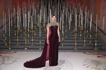 Priyanka, who made her debut internationally with the American drama series "Quantico", opted for a wine red strapless Ralph Lauren gown with a billowing train paired with an embellished gold chain headdress reminiscent of a medieval knight. She completed her look with subtle make-up and maroon lips.