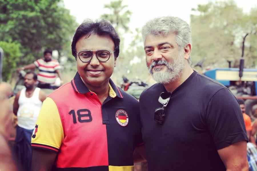 Viswasam music director D Imman meets Thala Ajith at the movie's shooting spot. The team is currently shooting song sequences for the film at Ramoji film city in Hyderabad. Imman took social media and shared a picture on Twitter with the caption, "Not so often i get the opportunity to view the visual making of my songs! But today it was pure Bliss to watch the Man of Simplicity to enjoy n dance to my tune in #Viswasam Thanks Ajith Sir for the invite Thanks a ton @directorsiva sir and @SathyaJyothi_ #DImmanForViswasam PG!". Viswasam movie directed by Siva and produced by Sathya Jyothi Films. Starring Nayanthara, Thambi Ramaiah, Bose Venkat and Yogi Babu. Imman,D Imman,Ajith,Ajith Viswasam,Viswasam,Viswasam on the sets,Viswasam shooting spot,Viswasam shooting spot pics,Viswasam shooting spot images