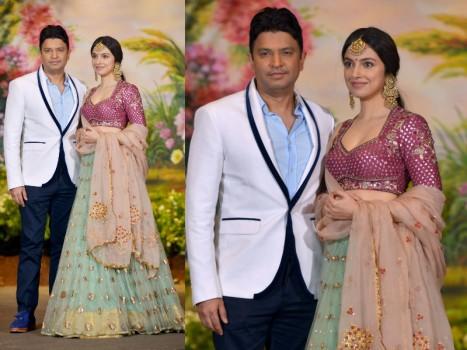 Power couple Bhushan Kumar and Divya Khosla Kumar looked stunning together as they made an appearance at Sonam Kapoor and Anand Ahuja's reception last night. Suited in a white and blue two-piece Bhushan Kumar looked dapper while Divya Khosla Kumar looked radiant as ever in an elegant lehenga.  Divya Khosla Kumar donned a mint green lehenga with golden embedded work and a dark punch pink blouse with a salmon pink dupatta with golden work. The actress turned director completed her look with intricate and delicate mangtika and long studded earrings. Bhushan Kumar's T-Series has been enjoying a golden run at the box office with back to back successes in the last two years. Out of the four films minting over 100 crores this quarter, the producer has two films to his credit with 'Sonu Ke Titu Ki Sweety' and 'Raid'.