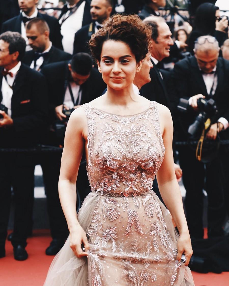 Bollywood actress Kangana Ranaut lived up to her 'bold and beautiful' image as she made her Cannes Film Festival red carpet debut in a sheer, embellished and backless gown here on Thursday. Kangana, who is hosted here by Grey Goose, awalked the red carpet for the screening of Christophe Honore's French drama "Plaire, aimer et courir vite". The actress wore a Zuhair Murad creation, which complemented her slender frame by being a perfect mix of sensuality with the romanticism of the sheer fabric, and boldness of the cut. Kangana Ranaut,Kangana Ranaut at Cannes,Kangana Ranaut at Cannes 2018,Kangana Ranaut in backless gown,Cannes Film Festival red carpet,Cannes Film Festival,celebs at Cannes Film Festival,Cannes Film Festival pics,Cannes Film Festival images