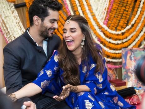 Candid pictures of couple from the intimate mehendi ceremony held in Delhi. Actress and former beauty queen Neha Dhupia surprised her fans and friends from the industry with the news of her hush-hush wedding with actor and 