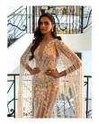 Actress Deepika Padukone showed her first red carpet look from Festival de Cannes this year as a L'Oreal Paris brand ambassador and she looked no less than an angel, and epitome of elegance, in a sheer white caped gown. She opted for a sheer lace creation by designer Zuhair Murad with nude lip and smoky eyes done by L'Oreal giving the finishing touch to her entire getup. Giving a glimpse of her look to her fans on Instagram, she posted a picture of herself and wrote: "Ready to rock and roll." Before this the actress also shared a picture in a white T-shirt, blue denims and nude heels from the festival.